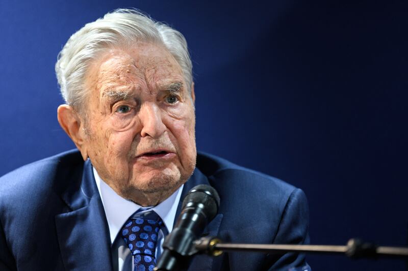Investor and philanthropist George Soros answers questions after giving a speech in Davos. AFP