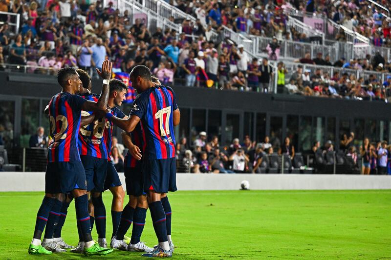 Raphinha, Alejandro Balde and Pierre-Emerick Aubameyang celebrate Ansu Fati's goal during a friendly match against Inter Miami. AFP