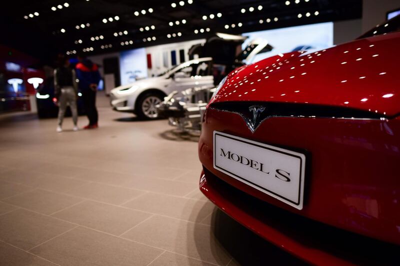 Tesla cars are shown at a store in Beijing on April 9, 2018. 
China said on April 6 it is ready to pay "any cost" in a trade war after US President Donald Trump threatened an additional 100 billion USD in tit-for-tat tariffs on Beijing. / AFP PHOTO / WANG ZHAO