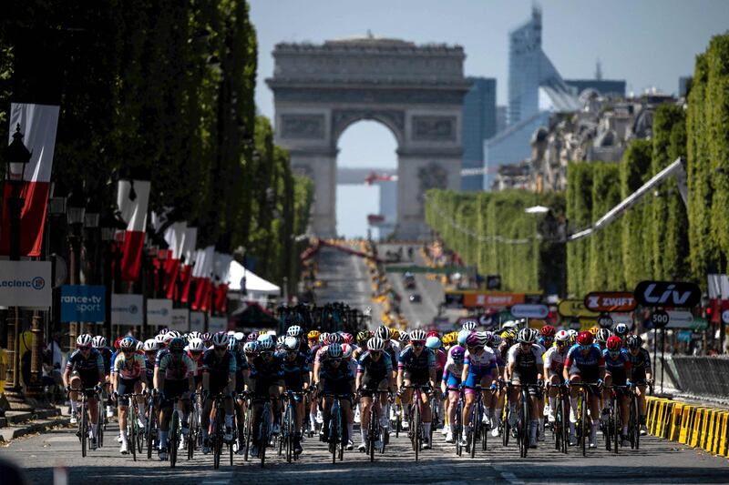 The peloton rides on the Champs Elysees. AFP