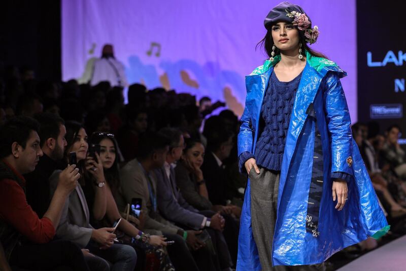 Aneeth Arora did a number of colourful headpieces and shrug-on jackets . EPA