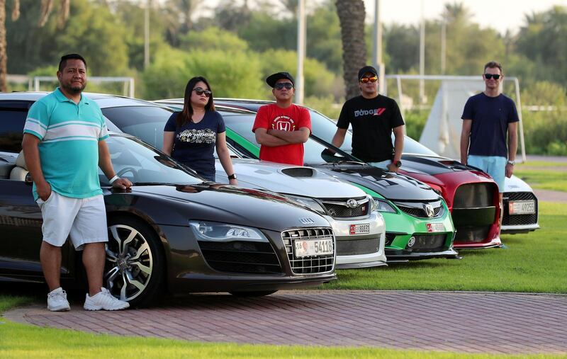 ABU DHABI , UNITED ARAB EMIRATES ,  October 14 , 2018 :- Left to Right ��� David Granados , Myra Madera , Louie Manalac , Arnold Quimio and Paul Newmark with their Modified cars for the StreeMeet car show which will be taking place on 26th October at the Abu Dhabi City Golf Club in Abu Dhabi. ( Pawan Singh / The National )  For Weekend. Story by Adam Workman