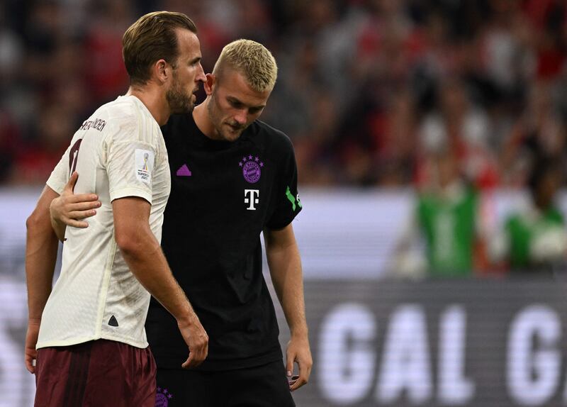 Harry Kane talks to Bayern Munich defender Matthijs de Ligt after the German Super Cup. AFP