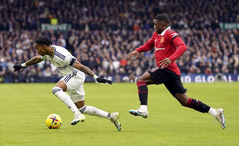 Leeds United's Crysencio Summerville and Manchester United's Tyrell Malacia. PA