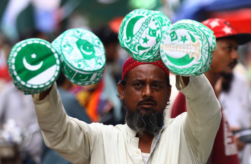 Patriotic headgear for sale in Karachi. EPA