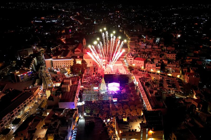 Fireworks illuminate Manger Square outside the Church of the Nativity in Bethlehem, in the Israeli-occupied West Bank. Reuters