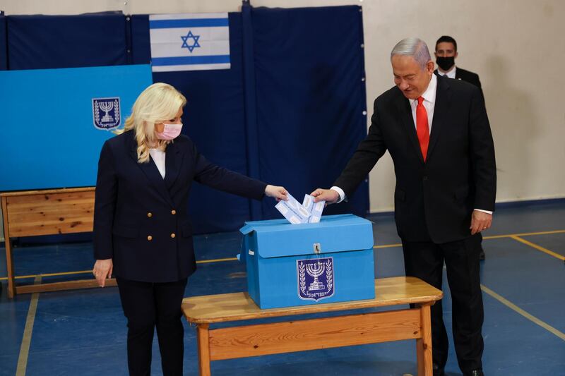 Israeli Prime Minister Benjamin Netanyahu and his wife Sara cast their ballots at a polling station in Jerusalem. EPA