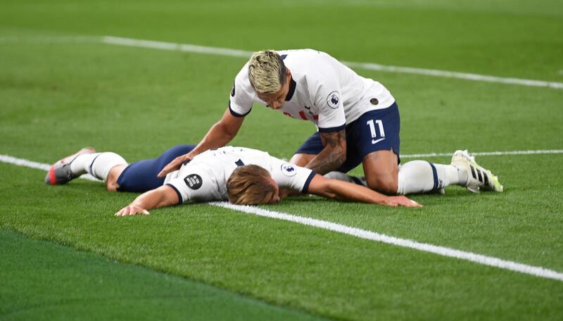 Tottenham striker Harry Kane celebrates scoring their second goal with Erik Lamela. Reuters