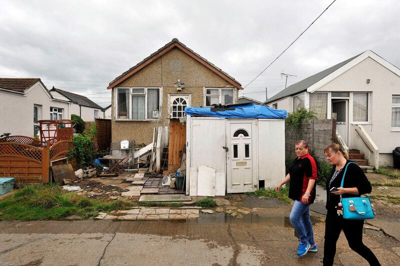 FILE - This Aug. 20, 2015 file photo shows a street in Jaywick, east England. The political battle raging in the United States as midterm elections approach has had an unexpected impact in a small coastal village in southern England. (Nick Ansell/PA via AP)