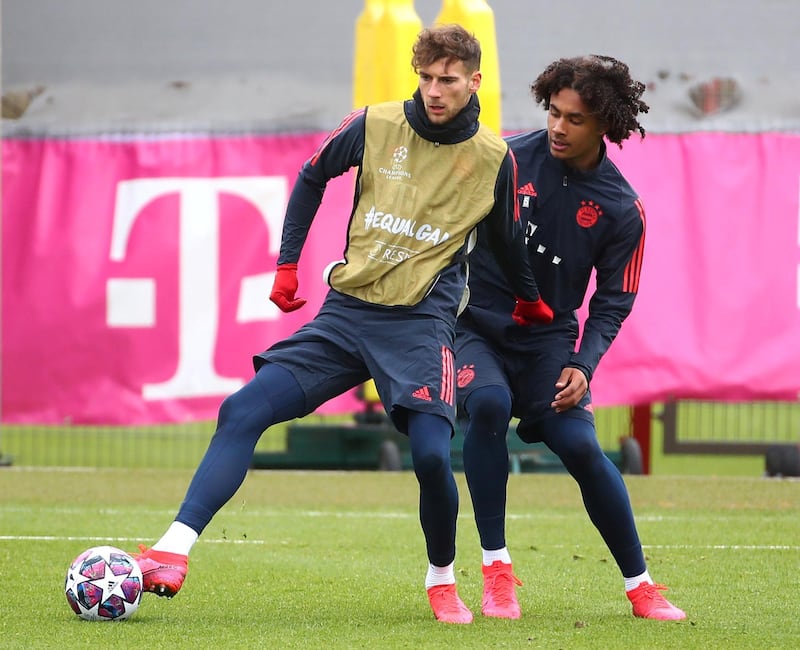 Bayern Munich's Leon Goretzka shields the ball from Joshua Zirkzee. Reuters