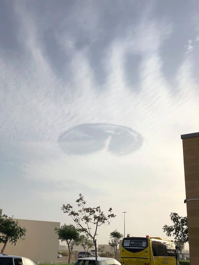 The fallstreak, or punch hole cloud, appeared above the skies in Al Ain on Sunday morning. Experts say it has not been seen in the UAE for a decade. Credit: David