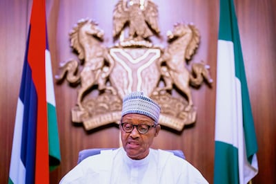 In this photo released by the Nigeria State House, Nigeria's President Muhammadu Buhari, address the nation on a live televised broadcast, Thursday, Oct. 22, 2020. Buhari has spoken to the nation about the unrest that has gripped the country in recent days but without mentioning the shootings of peaceful protesters at Lekki toll plaza on Tuesday night that prompted international outrage.  (Bayo Omoboriowo/Nigeria State House via AP)