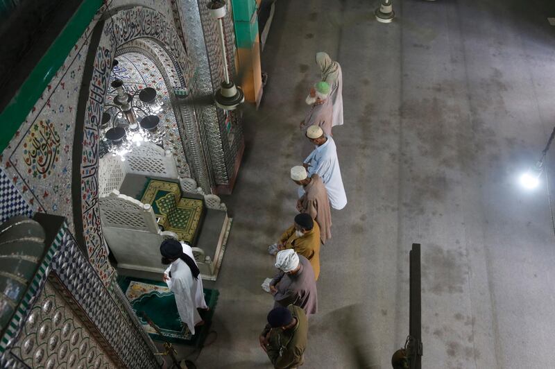 People attend Friday prayers at a mosque during a nation-wide lock down as a preventive measure against the outbreak of coronavirus, in Lahore, Pakistan, April 17, 2020. (AP Photo/K.M. Chaudhry)