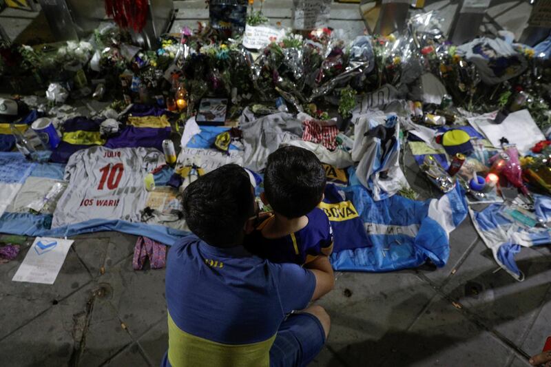 People mourn the death of  Maradona outside the Alberto J. Armando "La Bombonera" stadium. Reuters