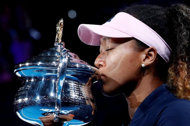 FILE PHOTO: Tennis - Australian Open - Women's Singles Final - Melbourne Park, Melbourne, Australia, January 26, 2019. Japan's Naomi Osaka kisses her trophy after winning her match against Czech Republic's Petra Kvitova. REUTERS/Kim Kyung-Hoon/File Photo