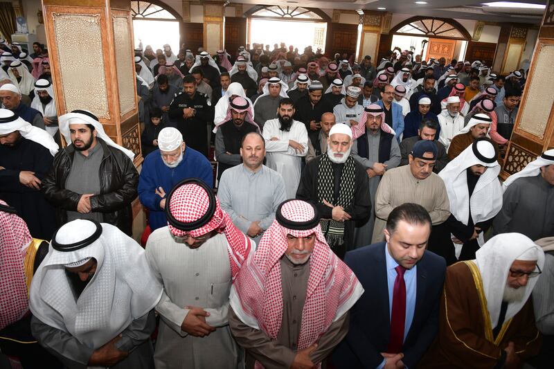 People pray during the funeral ceremony at the Bilal bin Rabah Mosque in Kuwait. AP