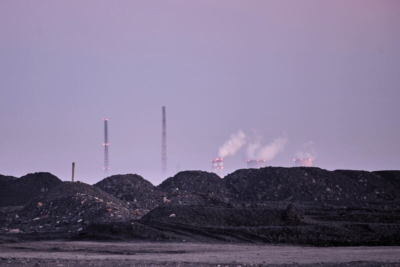 Vapour rises from cooling towers at the Rybnik Power Plant in Poland. Bloomberg