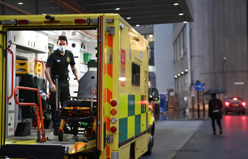 A NHS ambulance staff prepares his vehicle outside the Royal London hospital in London. EPA