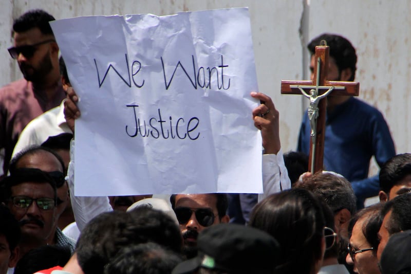 Pakistani Christians hold a demonstration condemning the recent attack on a Christian area in Peshawar, Pakistan. AP Photo