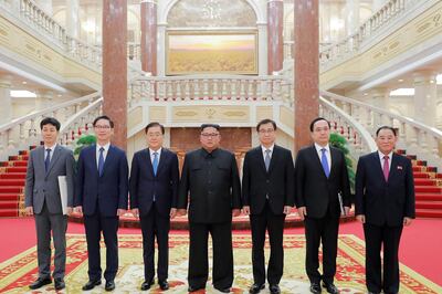 This picture from North Korea's official Korean Central News Agency (KCNA) taken on September 5, 2018 and released on September 6, 2018 shows North Korean leader Kim Jong Un (C) posing for a picture with a delegation of South Korean president's special envoy, led by Chung Eui-yong (3rd L), in Pyongyang. - Kim Jong Un will meet the South's President Moon Jae-in at a summit in Pyongyang in September to discuss the nuclear disarmament, Seoul said on September 6. (Photo by KCNA VIA KNS / KCNA VIA KNS / AFP) / South Korea OUT / REPUBLIC OF KOREA OUT   ---EDITORS NOTE--- RESTRICTED TO EDITORIAL USE - MANDATORY CREDIT "AFP PHOTO/KCNA VIA KNS" - NO MARKETING NO ADVERTISING CAMPAIGNS - DISTRIBUTED AS A SERVICE TO CLIENTS
THIS PICTURE WAS MADE AVAILABLE BY A THIRD PARTY. AFP CAN NOT INDEPENDENTLY VERIFY THE AUTHENTICITY, LOCATION, DATE AND CONTENT OF THIS IMAGE. THIS PHOTO IS DISTRIBUTED EXACTLY AS RECEIVED BY AFP. / 