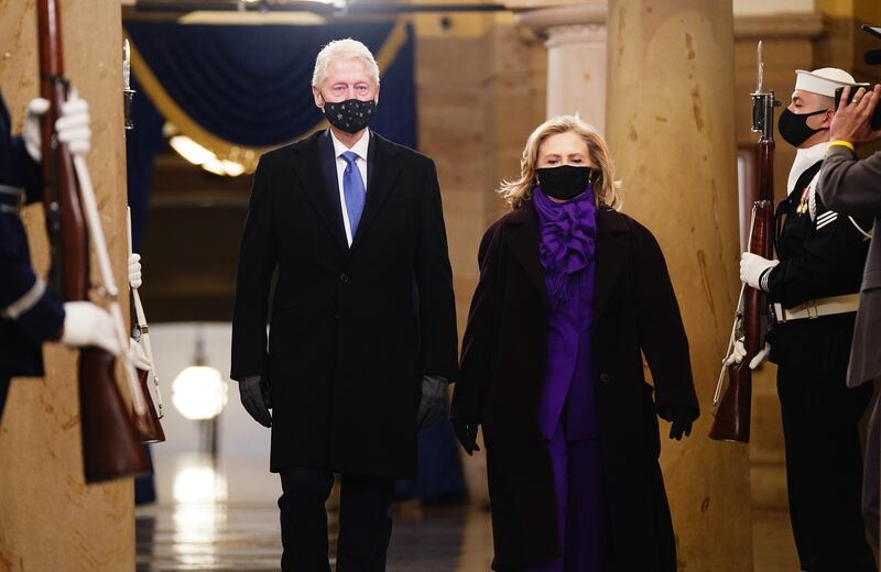 Hillary Clinton wore a deep-purple trouser suit by American label Ralph Lauren. EPA