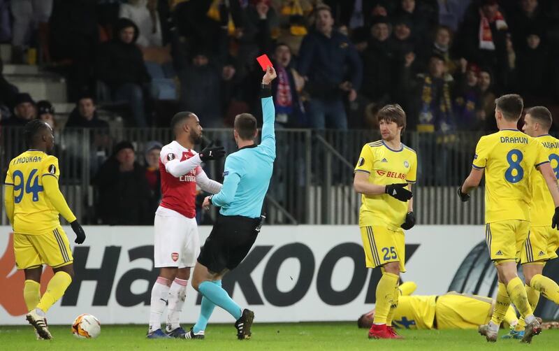 epa07370592 Arsenal's Alexandre Lacazette (2-L) is booked with a red card by Referee Srdjan Jovanovic (C) during the UEFA Europe League soccer round of 32 first leg match between FC BATE Borisov and Arsenal FC in Borisov, Belarus, 14 February 2019.  EPA/TATYANA ZENKOVICH
