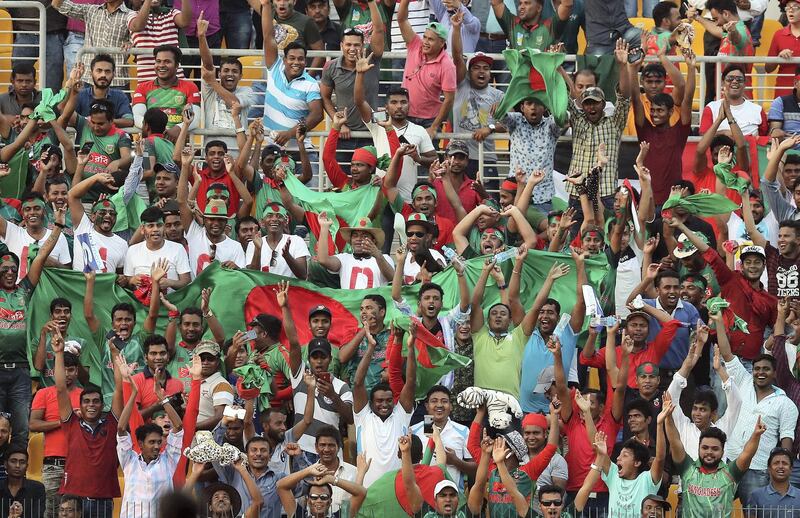 Abu Dhabi, United Arab Emirates - September 20, 2018: Bangladesh fans celebrate another wicket during the game between Bangladesh and Afghanistan in the Asia cup. Th, September 20th, 2018 at Zayed Cricket Stadium, Abu Dhabi. Chris Whiteoak / The National