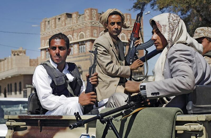 Houthi  rebels ride in a military truck in Sanaa. Hani Mohammed / AP