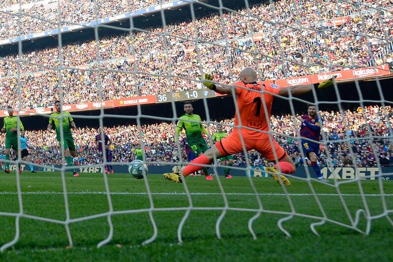Eibar's Serbian goalkeeper Marko Dmitrovic fails to stop the ball kicked by Barcelona's Argentine forward Lionel Messi. AFP
