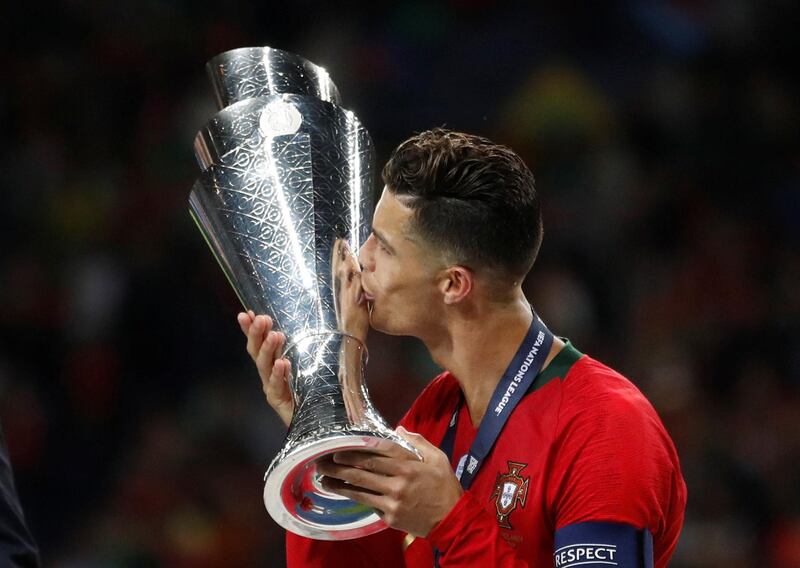 Cristiano Ronaldo kisses the Nations League trophy after Portugal beat the Netherlands. Reuters