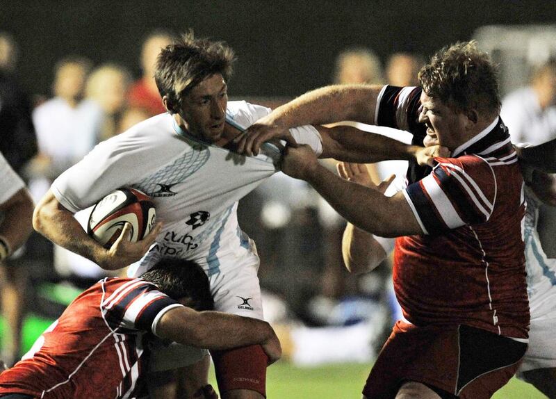 UAE rugby captain Adam Telford, pictured in action against Lloyds RFC, believes the national team has made great strides. Jeff Topping / The National