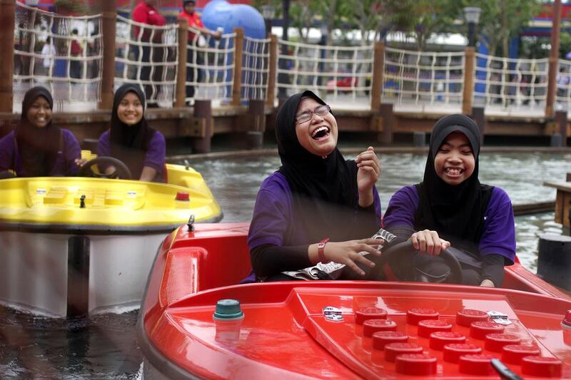 Girls ride in Lego-themed boats of Legoland Malaysia. Groundwork has started on a similar park in Dubai, which is expected to open by 2016. Rahman Roslan / Bloomberg News