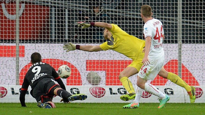 Eren Derdiyok, left, puts the ball on net for Bayer Leverkusen on Saturday. Patrik Stollarz / AFP  