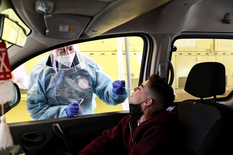 A boy is tested for Covid-19 at a drive-through site in Jerusalem. Reuters