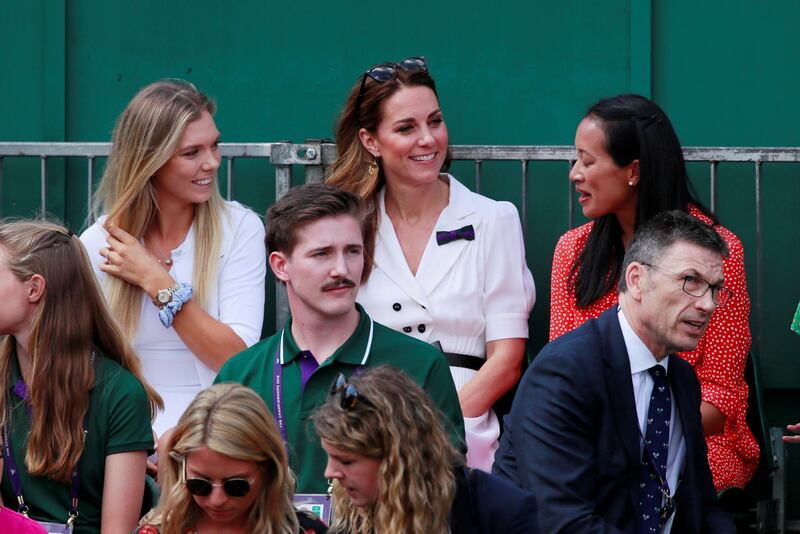Kate Middleton, Duchess of Cambridge, sits with former British tennis player Anne Keothavong, right, and current player Katie Boulter during the first-round match between Britain's Harriet Dart and Christina McHale of the US. Reuters