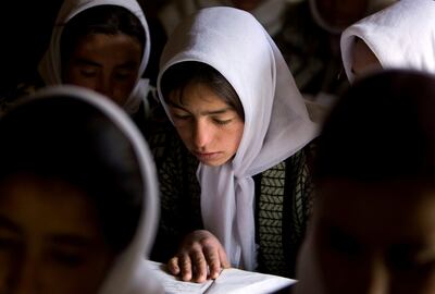 FILE PHOTO: Afghan girls attend a class at the Ishkashim high school for girls in the northeastern province of Badakhshan, near the border with Tajikistan, Afghanistan April 23, 2008.  REUTERS