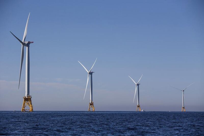 Green bonds can be used to fund projects such as wind farms and solar plants. Scott Eisen / AFP