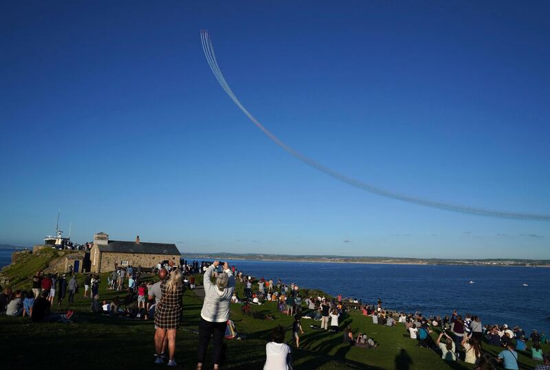 The Red Arrows fly over Carbis Bay and St Ives during the G7 summit. AP