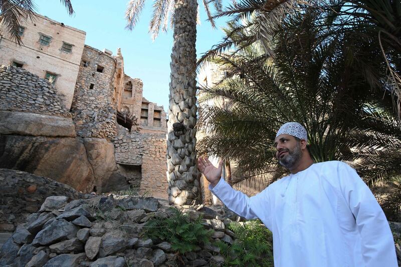 Omani citizen Yacoub Al Abri shows off his home village of Misfat Al Abriyeen, where mud-brick houses were turned into boutique hotels to attract tourists. AFP