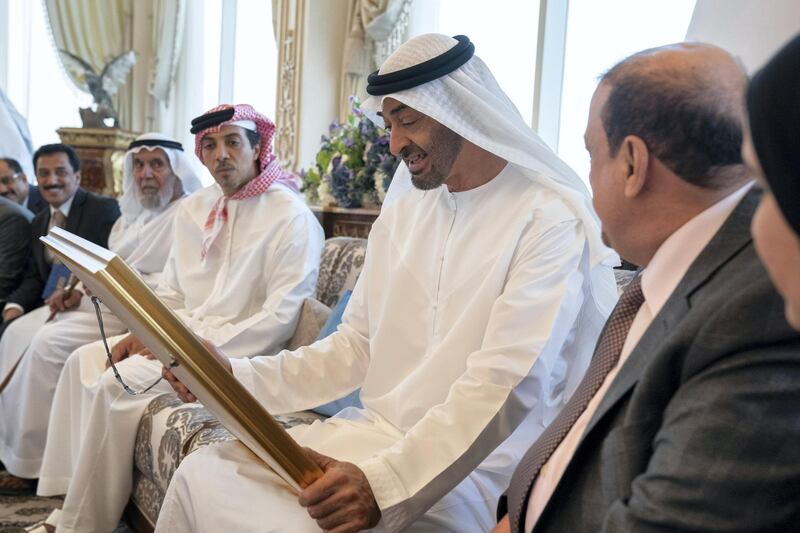 ABU DHABI, UNITED ARAB EMIRATES - July 15, 2019: HH Sheikh Mohamed bin Zayed Al Nahyan, Crown Prince of Abu Dhabi and Deputy Supreme Commander of the UAE Armed Forces (2nd R), receives a gift of a framed photograph from Sultan Al Burkani, Speaker of the Yemeni Parliament (R), during a Sea Palace barza. Seen with HH Sheikh Mansour bin Zayed Al Nahyan, UAE Deputy Prime Minister and Minister of Presidential Affairs (3rd R).

( Mohamed Al Hammadi / Ministry of Presidential Affairs )
---