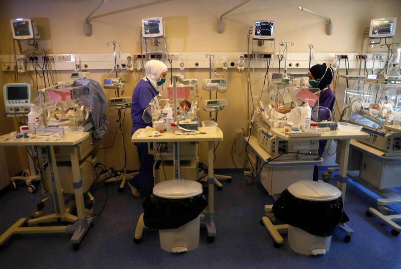 Neonatal intensive care unit nurses checks newborn babies, at a governmental hospital, in Tripoli, north of Lebanon.  AP