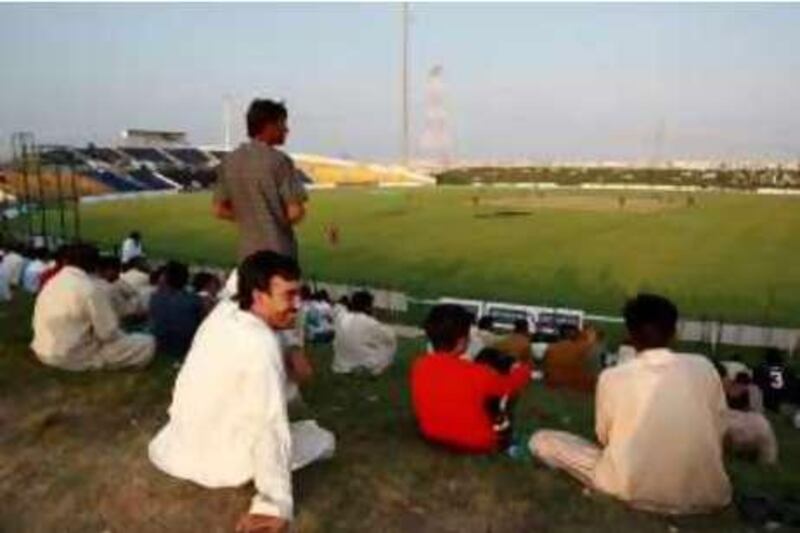 Abu Dhabi - 16TH November,  2008 -Pakistani Fans  watch  Pakistan v West Indies during the 3rd  One Day international Fortune Cup at the Zayed Cricket Stadium , Abu Dhabi     ( Andrew Parsons  /  The National ) *** Local Caption ***  ap0023-1611-pakistan v west indies.jpg