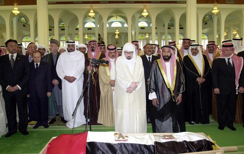 Muslim leaders and officials pray over the body of Sheikh Zayed bin Sultan al-Nahayan during his funeral at Abu Dhabi's Sultan bin Zayed Mosque 03 November 2004. Nahayan, the president and founding father of the United Arab Emirates, died 02 November 2004 after more than 30 years at the helm of his oil-rich country. Seen in the second row from L to R: Pakistan's President Pervez Musharraf, Algeria's Abdelaziz Bouteflika, Afghanistan's Hamid Karzai, Sheikh Khalifa bin Zayed, the eldest son of the late Emirati president, Saudi Arabia's Crown Prince Abullah bin Abdul Aziz, Bahraini King Hamad bin Issa al-Khalifa, Yemeni President Ali Abdullah Saleh, Saudi Interior Minister Nayef bin Abdul Aziz and King Abdullah II of Jordan.     AFP PHOTO/HO/WAM