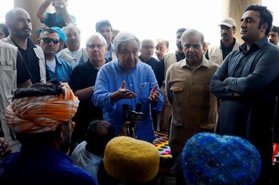 UN Secretary General Antonio Guterres, Pakistan Prime Minister Shehbaz Sharif and Pakistan Foreign Minister Bilawal Bhutto Zardari talk to displaced men at an aid camp in Larkana last week. Reuters
