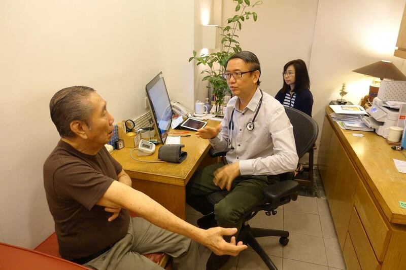 Dr Goh Wei Leong seeing his patient in the consultation room of Manhattan Medical Centre, Singapore on August 15, 2016. Lee Yong Wei for The National