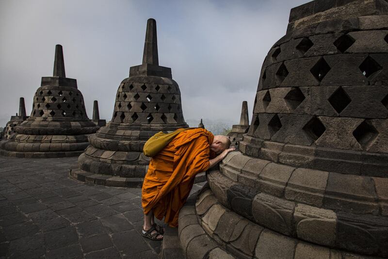 A Buddhist monk prays at Borobudur temple during celebrations for Vesak Day in Magelang, Central Java, Indonesia. Getty