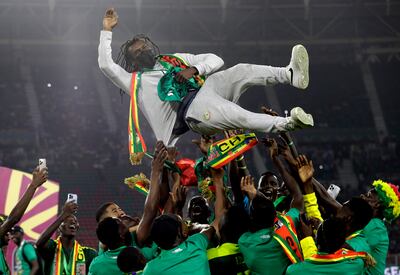 Senegal's players throw manager Aliou Cisse in the air after winning the Africa Cup of Nations. AP