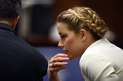 Actress Amber Heard talks to her lawyer in the courtroom at the Fairfax County Circuit Courthouse in Fairfax, Virginia. EPA