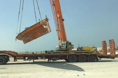 A boat is towed and impounded from the fisherman's port in Shahama. Courtesy Abu Dhabi Municipality