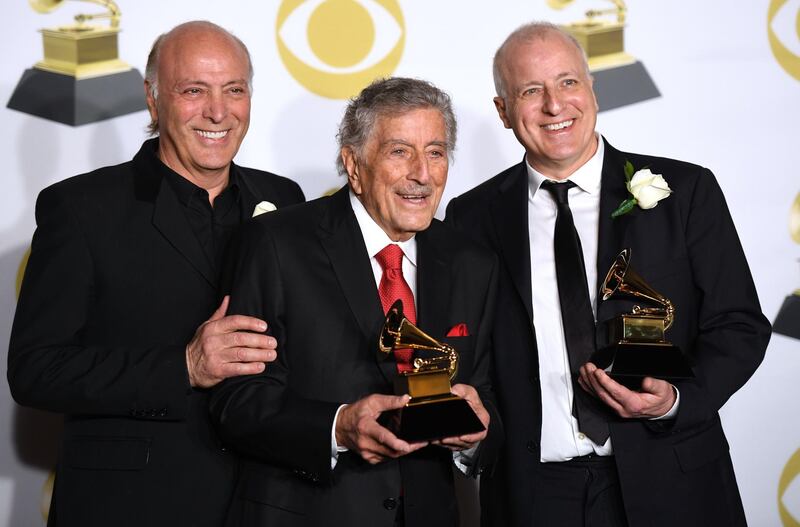 Danny Bennett,Tony Bennett and Dae Bennett, winners of Best Traditional Pop Vocal Album for 'Tony Bennett Celebrates 90,' pose in the press room. AFP